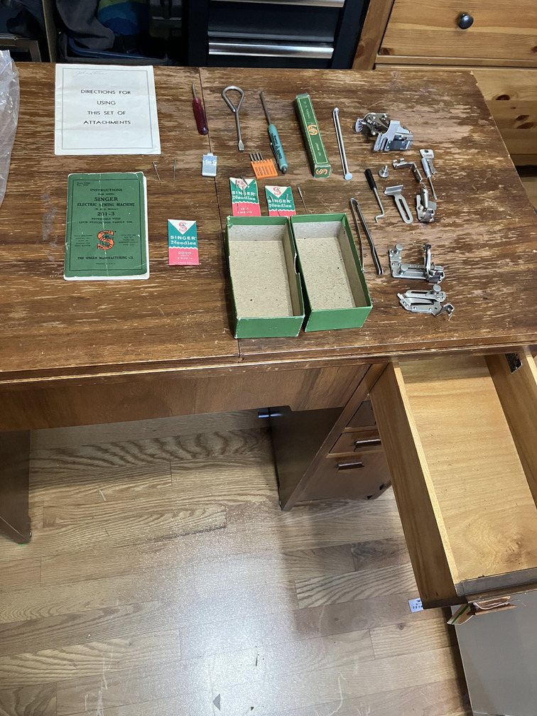 Manuals, needles and attachments laid out
